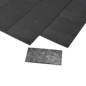 a black tile on a white surface