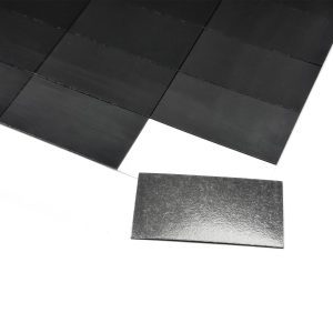 a black rectangular object on a white surface